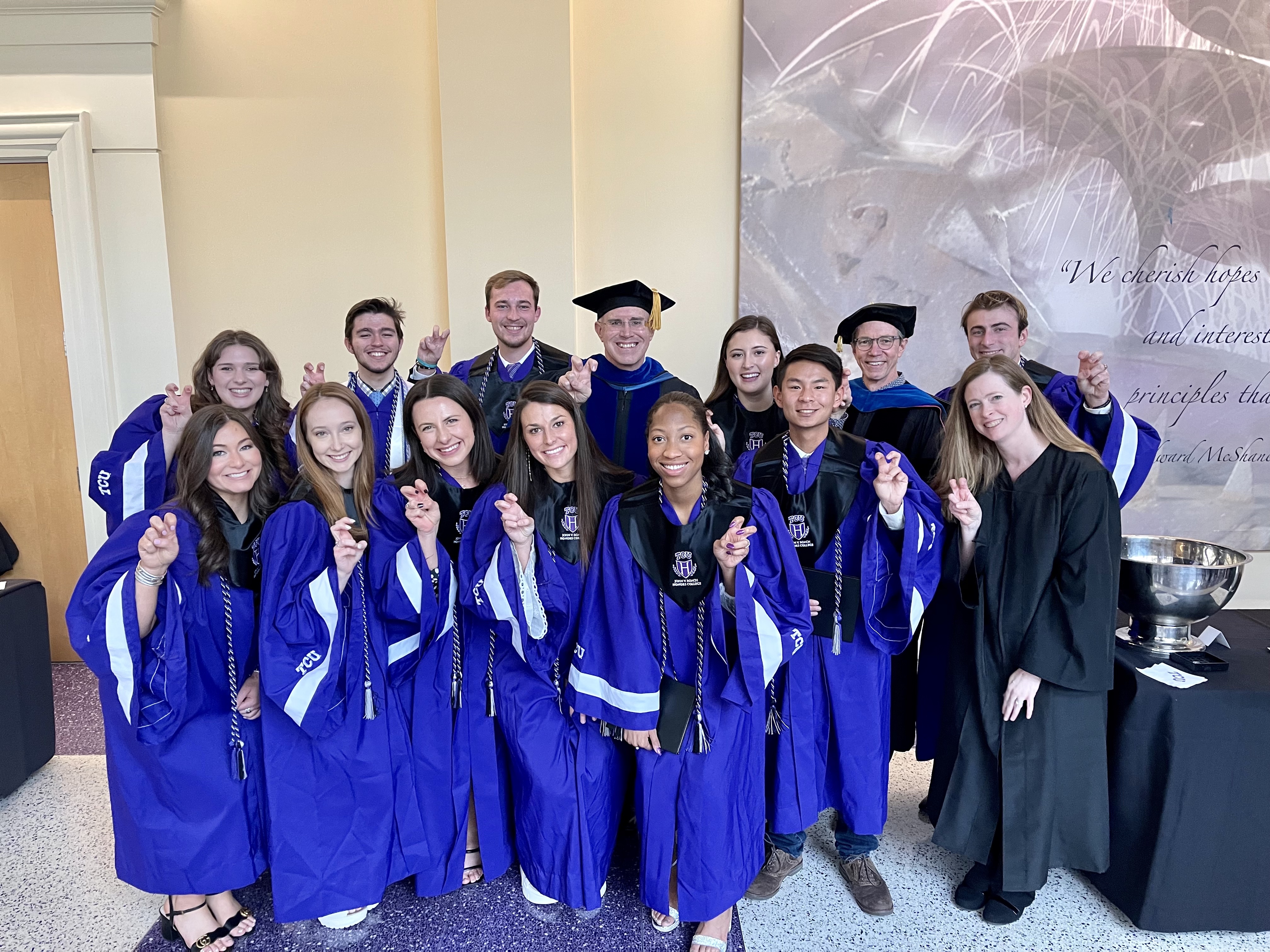 Honors Laureates in regalia holding the 